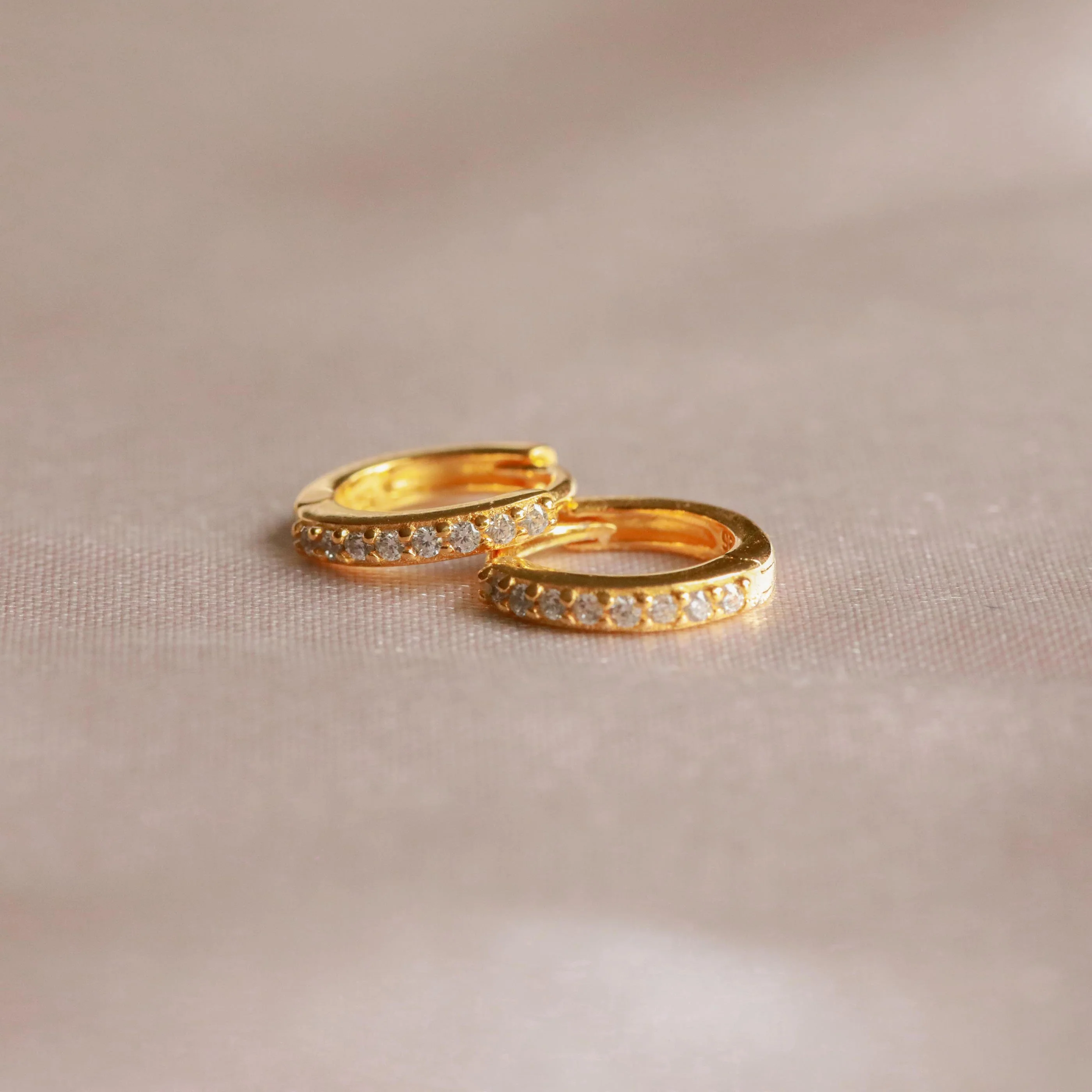 April Birthstone Huggies in Gold with Clear CZ - Image 3