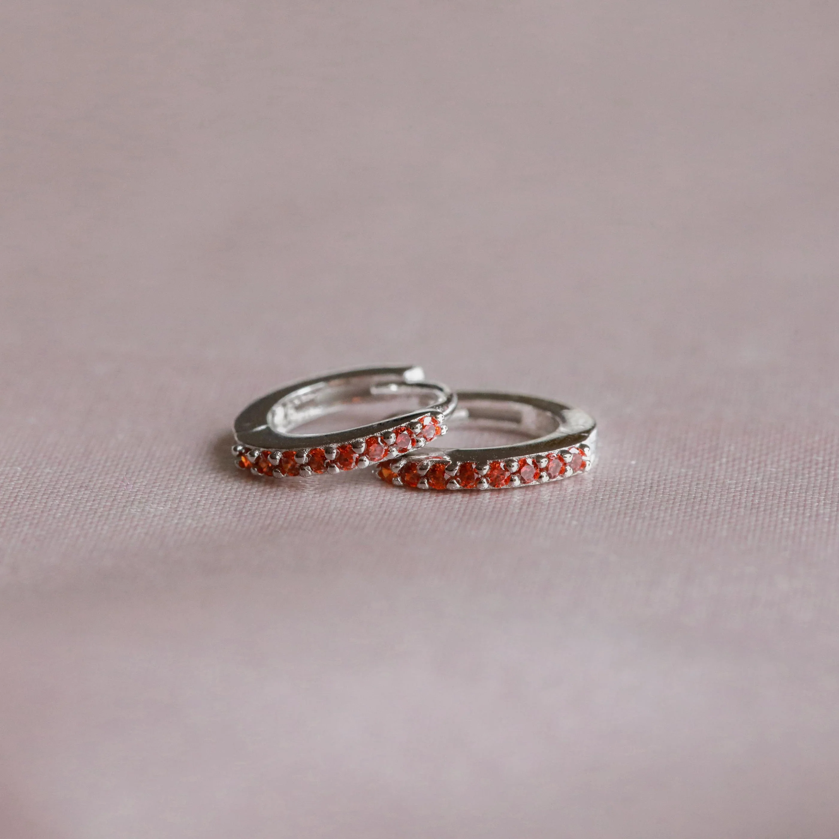 January Birthstone Huggies in Silver with Garnet CZ - Image 3