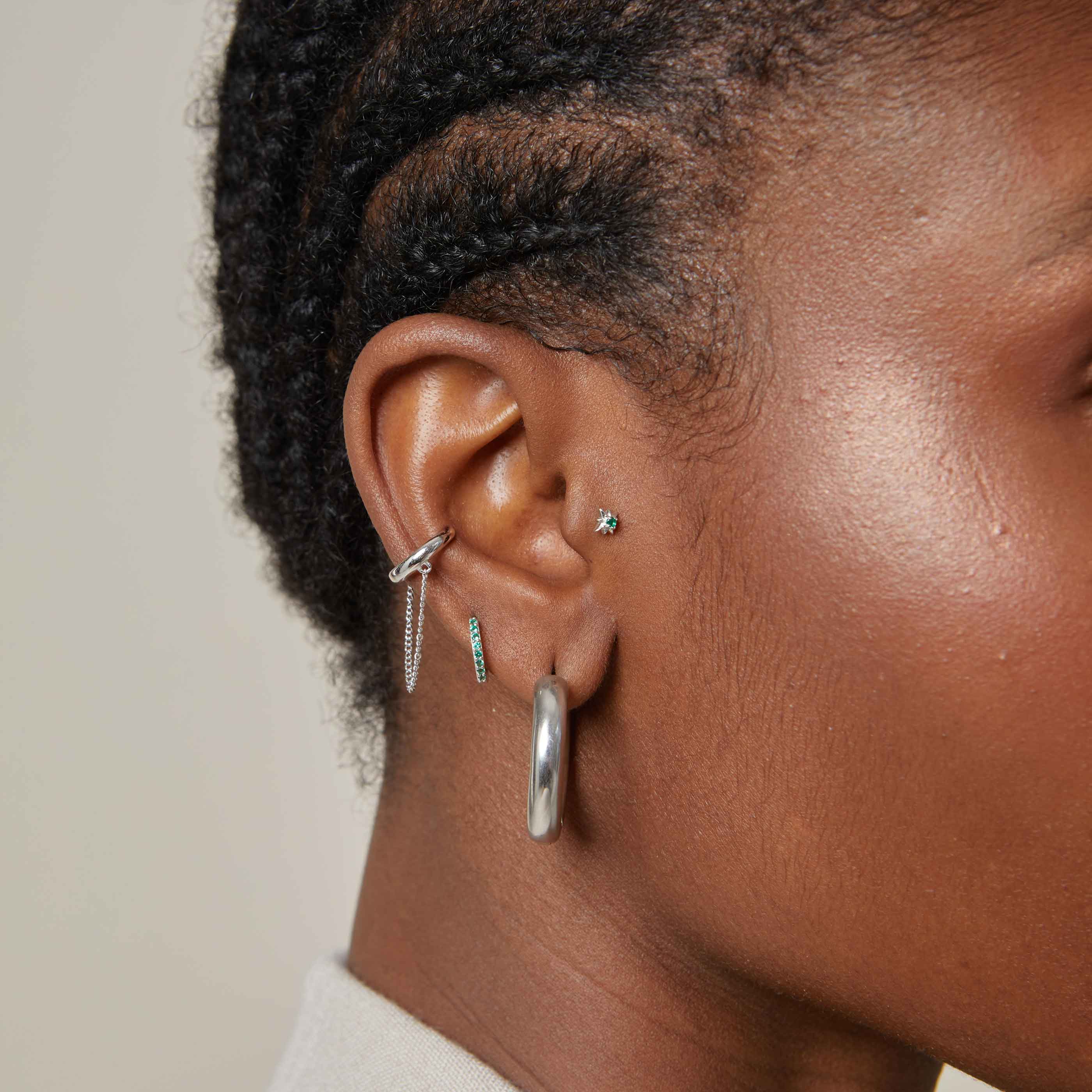 May Birthstone Huggies in Silver with Emerald CZ - Image 6